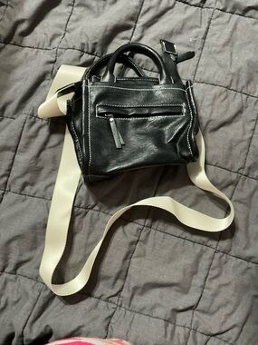 Compact Black Leather Crossbody with Cream Webbed Strap
